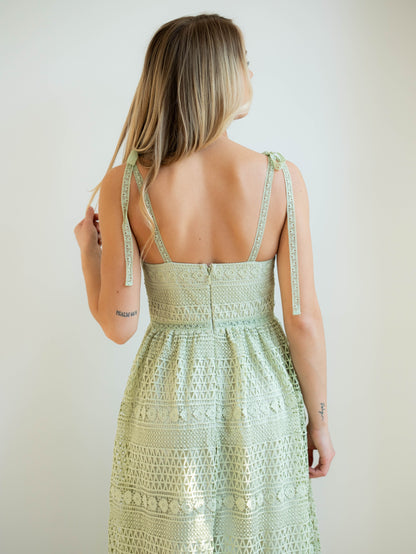 sage green crochet dress, back of model, zipper with hook for secure closure